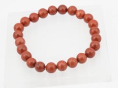 Original Red Jasper Bracelet 110 Carat placed on a white selenite plate